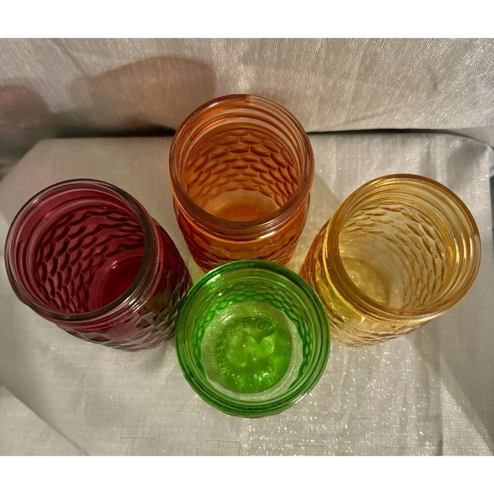Set of 4 modern, colorful glass jars w/ hexagon stamped pattern
